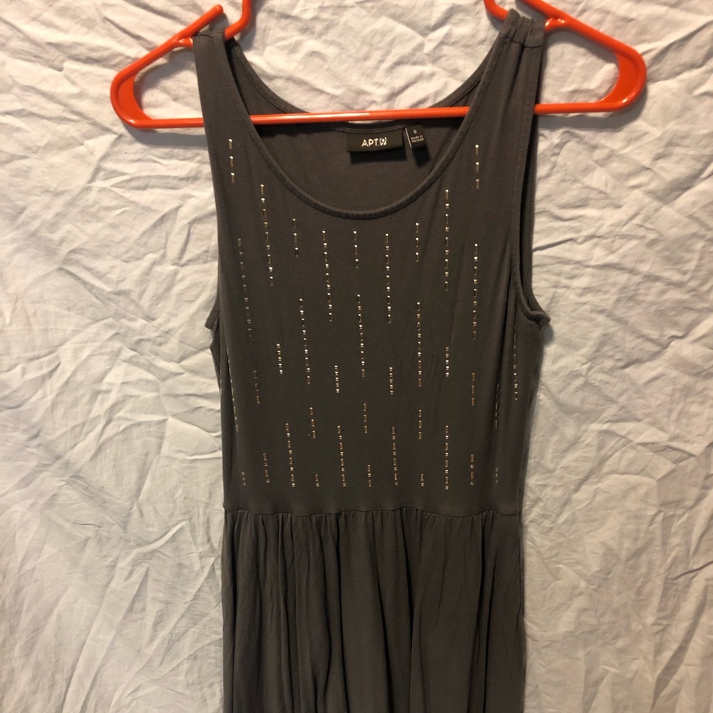 Grey dress. Goes below knees. Has pockets.